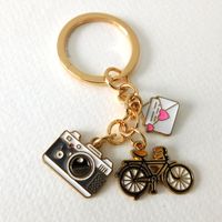 - Keychain / Keyring - Multi charm detail - Camera, Letter & Bike - Multi coloured - Measures approximately 8.5cm/3.3inches in length