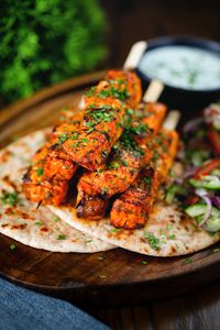 Indian salmon tikka skewers are the perfect way to change up your curry game, they are easy to make and, marinade time aside, very quick.  #salmontikka #salmonskewers #salmonontheBBQ #indiansalmonercipes #easysalmondinner #fishfortea #marinadesalmon #tastytea #tastydinner #simplemeals #deliciousdinners #simplefishrecipes #easysalmondinner #healthyfamilymeal