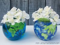 Set of two vases Easy DIY Globe Vases, one with tissue paper and one with paint.  Way cool!