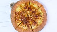 <p>Marmite livens up this cheesy pizza, our new favourite party recipe for fans of the spread. Even those who don't love it may find they change their minds</p>