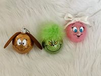 Deck your Christmas tree with some of the most loved Christmas characters!  These glass ornaments are 2.5inch diameter and handcrafted.    Get the complete set of the Grinch, Max, and Cindy Lou OR A set of the Grinch & Max OR Just the Grinch!  These ornaments come in a sturdy box and protective wrap that makes them perfect for giving as gifts or for storing when not on your tree!