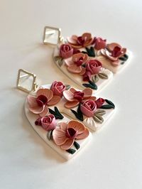 Handcrafted polymer clay earrings perfect for any occassion! Width: 1.5 inches Height: 2 inches