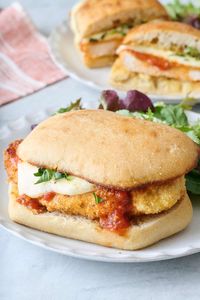 These chicken parm sandwiches have crispy, delicious chicken topped with marinara sauce and mozzarella cheese on a ciabatta roll. | Chicken Parm Sandwich