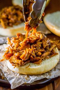 Sweet Crock Pot Pulled Pork! Transform your favorite BBQ sauce into deliciously sweet crock pot pulled pork that goes perfectly with just about any sandwich or taco topping. | HomemadeHooplah.com