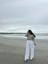 linen pants peach sweater coastal grandma new england beach vibes pose converse summer 