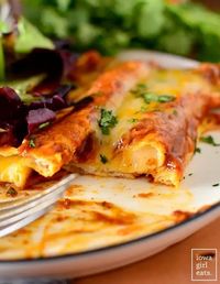 Cheese Enchiladas with Red Sauce is a simple yet outstanding dinner recipe! You'll flip over my easy, homemade red enchilada sauce too. iowagirleats.com keywords: gluten free dinner recipes, vegetarian dinner recipes, gluten free recipes, easy mexican food, cheese enchilada recipe, dinner recipes, dinner ideas, gluten free dinner ideas, gluten free dinners easy