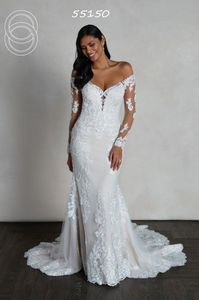 Off the shoulder beaded lace long sleeve bridal gown. Available off the rack at Silk Bridal Studio.