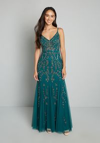 In a vintage-inspired shade of emerald green, this swishy beaded gown is a dream come true!