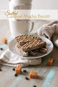 Salted Caramel Mocha Biscotti! A crunchy, chocolate-coffee cookie with little bits of chewy caramel dotted throughout drizzled with white chocolate, gooey caramel and sprinkled with sea salt. A perfect treat for enjoying with a cup of coffee or tea.