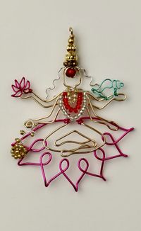 Goddess Lakshmi Pendant Tutorial. Made with @beadalon Artistic wire in various colours and gauges. Click image for tutorial on YouTube.