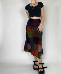 Flared patchwork midi skirt. Patch placement and coloring will vary slightly on each skirt! Model is 5’2 and wearing a size small.