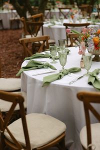 Colorful garden wedding garden florals pink lavendar blue orange yellow daisies billy balls ranunculus garden roses stock delphinium tablescape sage green napkins