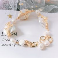 This beautiful Freshwater pearl bracelet ranges between 10-14mm in size and consists of beautiful and lustrous pearls in AAAA+ quality. All pearls in this bracelet are round and are strung with silk thread and double-knotted between each pearl. Known as the 'icon' of cultured pearls, Freshwater pearls have graced the necks, ears, fingers, and wrists of women for decades. Huge Tomato imports their Freshwater pearls from the Freshwater rs of Japan, grown in the Pinctada fucata oyster.