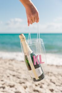 The Monogram Wine Bag will keep your wine chilled on your way to a party while also giving your The Perfect Summer Hostess Gift!