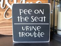 "This funny bathroom sign is a funny piece of decor sure to make friends and family laugh. It's 5.5\" square and 3/4\" thick. It stands on a shelf or countertop on its own and does not come with hanging hardware."