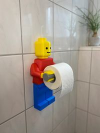 BrickBot Bathroom Buddy - 3D Printed Lego Character Toilet Paper Holder | Lego Lover Gift Ideas for just $45.00 #BathroomAccessories #LegoMan #InspiredHomeDecor #ToiletPaperHolder #BathroomDecor #NoveltyBathroom #KidsBathroomDecor #LegoCharacter #LegoMovie #LegoPaperHolder