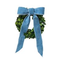 Bring the holidays home with our exclusive Cailíní Coastal Preserved Boxwood Wreath. Adorned with a lush velvet dusty blue ribbon, this classic Christmas wreath offers endless styling options in two sizes. The large wreath is ideal for hanging above a cabinet door or window, while the small wreath is the perfect accent to the backs of dining chairs, cabinets or bookshelves. The leaves are made from natural preserved boxwood greens and have a deep green color that is soft to the touch. For indoor