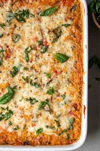 Filled with tomatoes, spinach, and ricotta cheese, this one-dish baked orzo casserole is creamy, cheesy, and easy to make.