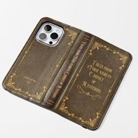 Inspired by the timeless charm of vintage book covers, each case offers a unique and personalized touch that combines classic aesthetics with modern functionality. Crafted from high-quality faux vegan leather, these cases offer a perfect blend of style and practicality. Our flip cases provide a dual purpose: serving as a protective layer for your phone and as a convenient stand for media viewing. The flat, elastic fastening ensures your case stays securely closed, while the durable polycarbonate