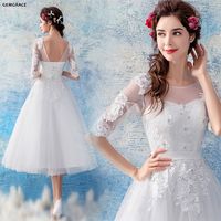 $98.99, Retro Tea Length Tulle Wedding Reception Dress With Half Sleeves #T69295 at GemGrace. #2019 #BeachWeddingDresses Shop now to get $10 off. Biggest new arrivals for wedding dresses and prom dresses at wholesale prices. View Wedding Dresses,Special Occasion Dresses,Beach Wedding Dresses,Wedding Dresses with Sleeves,Reception Dresses,White Prom Dresses,Prom Dresses with Sleeves for more ideas. Click to view!