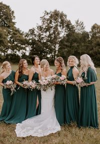 Mixed bridesmaids dresses in deep hunter green. Photography: @samanthaharrellphoto Venue: @thebarnatwhiteoaks