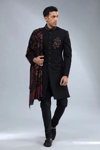 Our unique black sherwani crafted from fine-textured terry rayon is fitted with amazing embroidery, resham, sequins, zardosi, and beads, making it an elegant and timeless choice. Includes a matching bottom and dupatta as well.