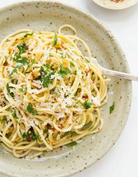 Spaghetti with garlic and olive oil is so simple, satisfying and inexpensive. The lovely smell of garlic and chilli gently fried in olive oil is delicious!