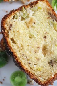 Make this quick green tomato bread to celebrate the change of seasons: it’s moist, sweet with tangy spikes, and utterly delicious! #whereismyspoon #greentomatobread #greentomatocake #greentomatodessert #greentomatorecipe #greentomatoes #quickbread #greentomatoloaf #loafcake #foodbloggerrecipes #goodfood #yummyrecipes