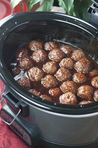 Crock Pot Grape Jelly BBQ Cocktail Meatballs are an awesome recipe for holiday entertaining, Super Bowl party, or pot luck made right in the slow cooker. They are so simple to make and extremely crowd-pleasing! @wishesndishes