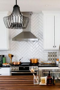 We can't say enough about the warming effect of wood. This all-white kitchen designed by Savas Construction gets an instant dash of organic appeal from its butcher block countertop, highlighted by our graphic Finn pendant in crisp matte black. 🖤 #ProgressLighting #SavasConstruction #PendantLighting #MatteBlackLighting #InteriorDesign #DesignTrends2024 #InteriorDesign #KitchenDesign #DesigningAKitchen #ButcherBlockCounter #FarmHouseKitchenInspiration