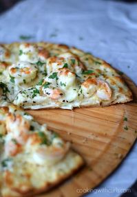 Shrimp Scampi Pizza with a thin, crispy crust, garlic-lemon sauce, and cheeses…