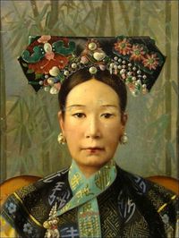 Empress Tzu Hsi wearing the traditional Manchu headdress