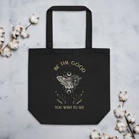 A Daily Dose of Kindness and Positivity: this bag's dark botanical design with a beautiful lunar moth illustration not only showcases your personality but also spreads a positive message.   It’s a daily reminder to be the change you wish to see in the world, making every journey a moment of inspiration.