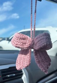 Elevate your car with this rearview mirror accessory!  This item is made with acrylic yarn and made to order. 🎀