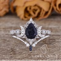 * Ring Material: 925 sterling silver, solid 14k rose gold, yellow gold, or white gold * Center Stone: Pear Shaped Faceted Blue Sandstone  * Center Stone Size: about 6x8mm * Side Stone: Colorless Moissanite, about 0.22ct * Sandstone in Marquise; * Bandwidth: 1.5mm 2-3 WEEKS PROCESSING TIME MADE IN US * Shipping * FREE SHIPPING WITHIN THE USA! * Certificate * All the items will come with the certificate by me.  * Shop Service * √ Free engraving(Up to 20 letters including the blank space) √ Custom/