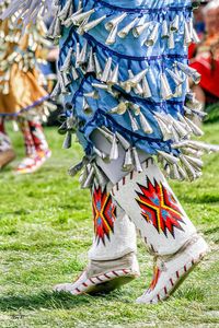 A photo of the wonderful colors of an Indian jingle dress on an Native American Indian participating in a pow wow. The jingles were originally made from lids of chewing tobacco cans TITLE: Jingle Dancer 2 Please choose your size and material (canvas, canvas in wood frame or print) from the drop-down menu above at the top right ►Canvas gallery wraps are printed onto artist grade canvas. Can be hung directly on a wall ►Unframed Prints are archival and shipped flat, or rolled in a tube for larger s