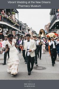 Vibrant, colorful wedding at the New Orleans Pharmacy Museum w/ second line & open air wedding reception, bride wore ruffled wedding dress, orange mismatched bridesmaid dresses, groom white tux jacket. Based in New Orleans, Michelle Norwood Events is the top destination wedding planner & event designer specializing in one-of-a-kind experiences at venues & locations all over the world. Plan an extraordinary destination wedding anywhere, including exotic beaches, mountains, deserts & vineyards.