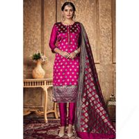 Look elegant when wearing this dark pink banarasi silk churidar suit which exudes feminine charm. This round neck and 3/4th sleeve suit elaborated using woven zari work. Available with silk churidar in dark pink color with dark pink banarasi silk dupatta. Churidar is plain and dupatta prettified with woven zari work.