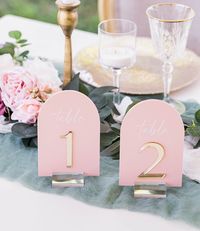 "Click on the following link to browse HUNDREDS more designs in our shop!! https://pinkposiesandpearls.etsy.com/                                           | Welcome to Pink Posies and Pearls Wedding and Gift Boutique | We love the sleek, clean lines of these clear acrylic table number signs. This acrylic is a display material that is strong, moisture resistant & visually clearer than glass, not to mention shatterproof! Choose between 4x6 or 5x7. | TO ORDER | *These table number signs are 1/8\" thick and can be printed on any of the acrylic sign colors in the image pictured. Simply choose your quantity of table numbers and stand choice. *       In personalization box, enter: sign color, lettering and mirror color for numbers (gold, silver or rose gold), #'s you need printed. Blush with whit