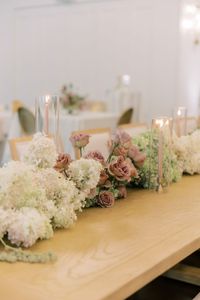 A fun and modern floral runner made of pink, white, and green color blocked flowers  | Florals: Cali and Bloom, Venue: The Peach Orchard, Photography: Shaimaa Photography, Linens: Premiere Events