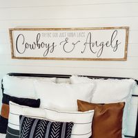 "Maybe God just kinda likes cowboys and angels 🤠😇 Free shipping in the continental U.S. White background with dark charcoal lettering or black 3D lettering and your choice of frame color. (to change the background or lettering color, put a note in the comment section at checkout) Available in 6 sizes: Shelf size - 7.5\" x 25.5\" x 1.5\" Twin size - 10.5\" x 37.5\" x 1.5\" Queen size - 13.5\" x 49.5\" x 1.5\" Queen size Lg - 17.5\" x 49.5\" x 1.5\" King size - 13.5\" x 66\" x 1.5\" King size Lg