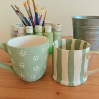 Green mug pottery painting, green mug with cute flowers, green and white striped mug, Easy pottery painting ideas