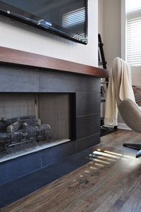 Idea to redo our brick fireplace surround with long narrow black tiles (that I already have!!!)