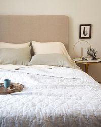 Linen Standard Pillowcases and Sheets in Parchment, Paloma Standard Pillowcases in Fog, Austin Quilted Coverlet in Sterling