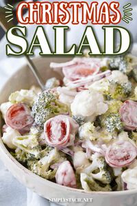 Christmas Salad - Contains all the colors of Christmas! This fresh, bright salad is made with broccoli, cauliflower, red onion and cherry tomatoes mixed with a creamy dressing.