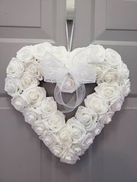 "Front door rose heart wreath. 14\" white heart wreath made with premium lightweight latex foam roses. Comes with a hanging ribbon on the back and white sheer bow. This is a pretty white heart wreath for your front door or for inside wall decor. Also can be for a sympathy gift or housewarming gift. Give as a birthday or wedding gift. Also would look lovely as a decoration to a wedding or party. Comes in many other colors. Thank you for visiting my shop Www.jessmadedesign.etsy.com Like my Faceboo