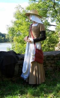 Brown peasant         Dress for working woman hand sewed form natural fabrics (15th century) consists of linen smock, brown dress, linen apron, woolen removable sleeves. Head is covered by linen veil and straw hat.