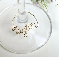 The custom wine glass charms will add a personalized touch to your special event, wedding or bachelorette party.  Handmade using strong wire and measure 1 to 1.5 inches wide depending on the name.  Available in gold, silver or copper.  www.deannewatsonjewelry.etsy.com