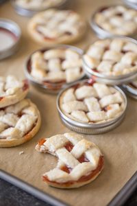 Buttery, flaky pie crust with strawberry jam for filling baked inside a mason jar lid!