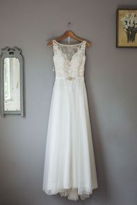 Lace silk satin wedding dress hanging up. Bridal prep photo ideas. Wedding in Devon